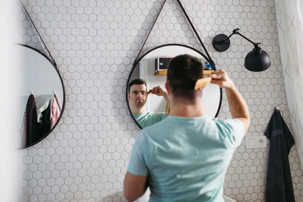 Disabled man combing his hair