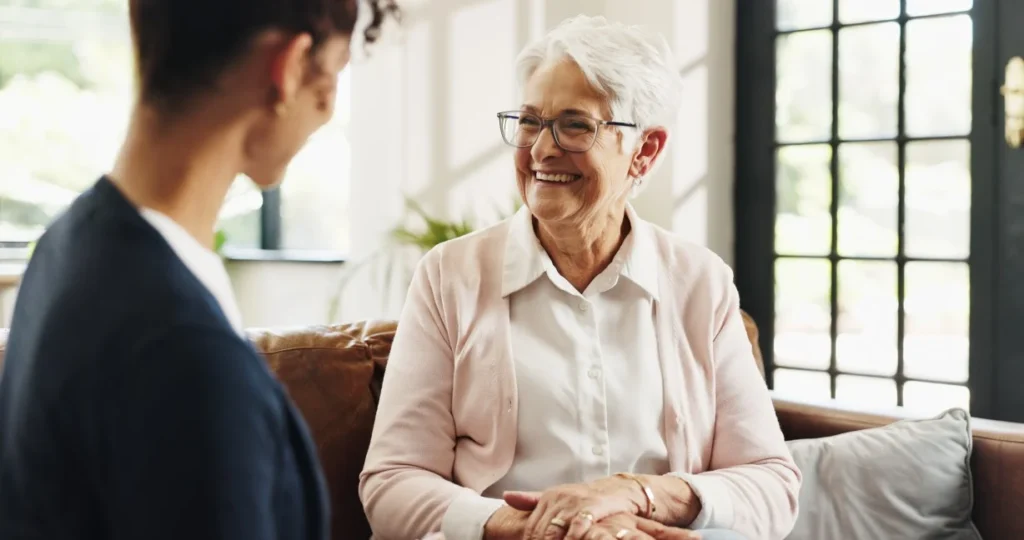 Nurse and elderly woman talking